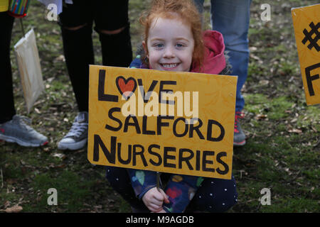 Salford, UK. 24th March, 2018. A girl with a sign which reads 'Love Salford Nurseries', Swinton, Salford, 24th March, 2018 (C)Barbara Cook/Alamy Live News Stock Photo