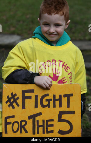 Salford, UK. 24th March, 2018. A young boy with a sign which reads 'Fight for the 5', Swinton, Salford, 24th March, 2018 (C)Barbara Cook/Alamy Live News Stock Photo