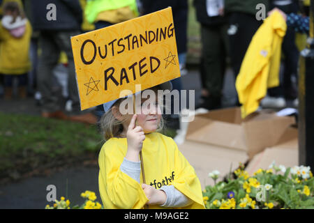 Salford, UK. 24th March, 2018. A girl holding a sign which reads 'Outstanding rated' referring to the schools threatened with closure, Swinton, Salford, 24th March, 2018 (C)Barbara Cook/Alamy Live News Stock Photo