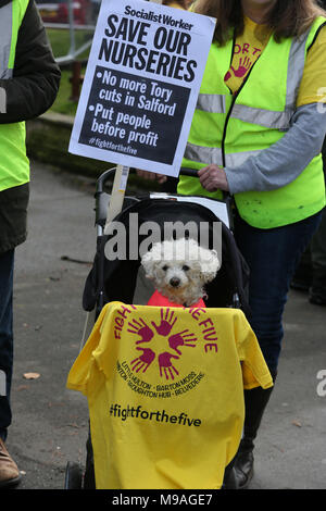 Salford, UK. 24th March, 2018. A small dog sitting in a pram at a 'Save our nurseries' protest, Swinton, Salford, 24th March, 2018 (C)Barbara Cook/Alamy Live News Stock Photo