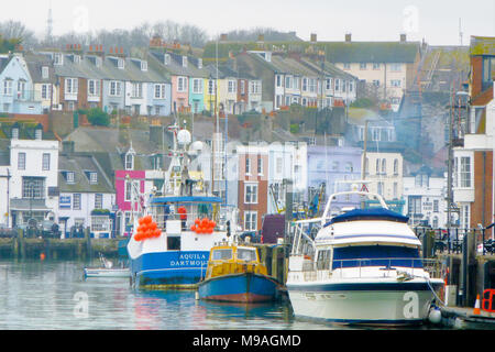 Weymouth, UK. 24th March, 2018. Weymouth harbour is busy on a much milder day for seafaring folk Credit: stuart fretwell/Alamy Live News Stock Photo