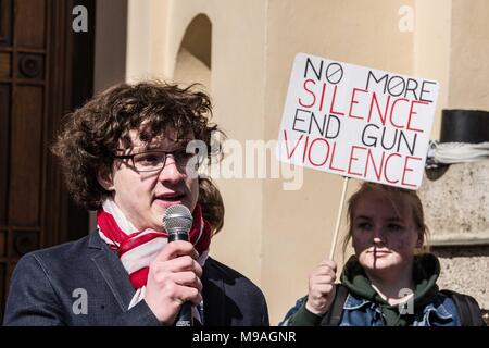 Munich, Bavaria, Germany. 24th Mar, 2018. Youth speaker Patrick Oberlaender (20). Joining some 838 events worldwide, over 350 expatriates in Munich, Germany held their own March For Our Lives demonstration in response to the activism sparked by the mass shooting at the Marjory Stoneman Douglas High School. The latest shooting and subsequent activism has put students and gun control advocates on a direct course against the National Rifle Association (NRA) who has in turn stepped up their lobbying and PR-offensives. One of the guest speakers was Pam Feldmann, the mother of a student at Parkl Cre Stock Photo