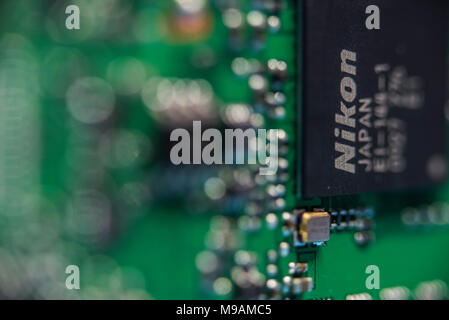 Reparing electronics devices, hands and tools, mobiles and computers. Nion reparing Stock Photo