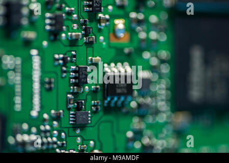 Reparing electronics devices, hands and tools, mobiles and computers. Nion reparing Stock Photo