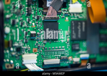 Reparing electronics devices, hands and tools, mobiles and computers. Nion reparing Stock Photo