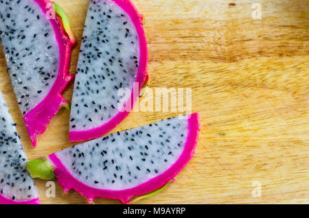 Pitaya Fruit slices on wood Stock Photo