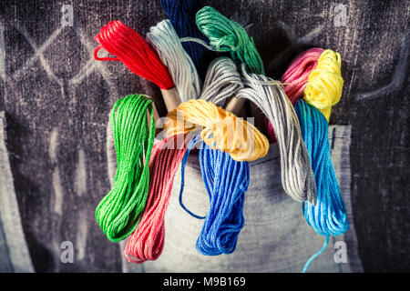 Colored threads in the mat tailor pocket Stock Photo