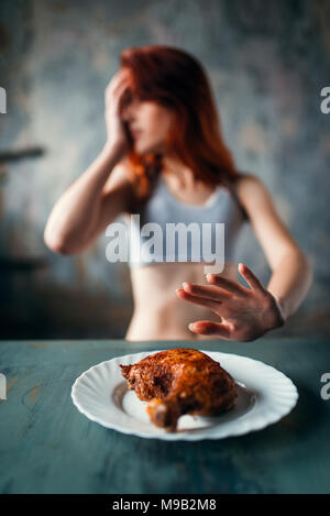 Skinny woman refuses to eat, anorexia Stock Photo