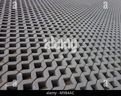 Concrete permeable grid pavers Stock Photo