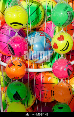 Neoi Poroi, region Pieria, Greece: August 26, 2016: group of colorful balls for kids in net in front of store for sale on bright sunny day Stock Photo