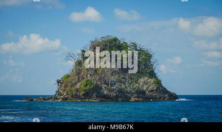 small island isolated in ocean water - tropical island - Stock Photo