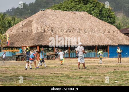Capurgana, Colombia - march 2018: Children playing soccer on the street in village center of Capurgana, Colombia. Stock Photo