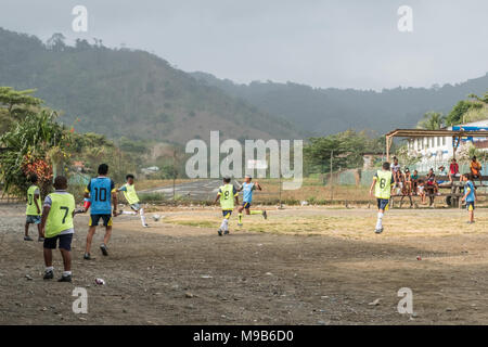 Capurgana, Colombia - march 2018: Children playing soccer on the street in village center of Capurgana, Colombia. Stock Photo