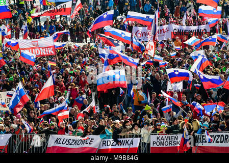 Planica, Slovenia. 24th Mar, 2018. Spectators cheering and watching competition of FIS Ski Jumping World Cup finals in Planica, Slovenia on March 24, 2017. Credit: Rok Rakun/Pacific Press/Alamy Live News Stock Photo