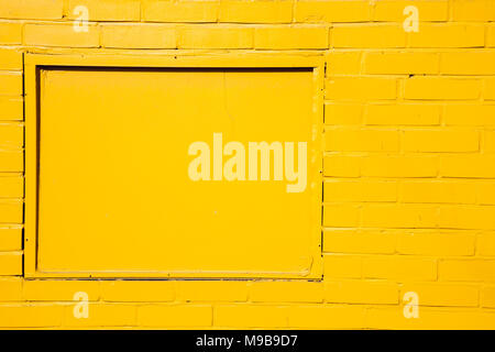 Yellow painted brick wall background Stock Photo