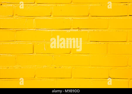 Yellow painted brick wall background Stock Photo