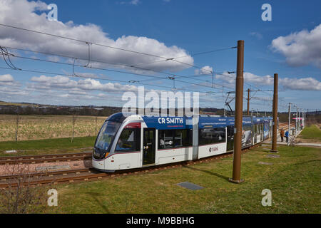 The Edinburgh Airport bound Tram departs Ingleston Park and ride station on its way to its destination, one of Scotlands newest Tram systems. Stock Photo