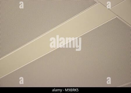 a perforated white ceiling background Stock Photo
