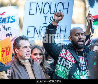 New York, USA. 24 March 2018. (L-R): New York State Governor Andrew Cuomo, her daughter Michaela Kennedy Cuomo, and Black Lives Matter New York President Hawk Newsome join a 'March For Our Lives' protest demanding gun control in New York City. Photo by Enrique Shore/Alamy Live News Stock Photo