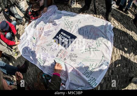 Munich, Bavaria, Germany. 24th Mar, 2018. Youth speaker Patrick Oberlaender (20). Joining some 838 events worldwide, over 350 expatriates in Munich, Germany held their own March For Our Lives demonstration in response to the activism sparked by the mass shooting at the Marjory Stoneman Douglas High School. The latest shooting and subsequent activism has put students and gun control advocates on a direct course against the National Rifle Association (NRA) who has in turn stepped up their lobbying and PR-offensives. One of the guest speakers was Pam Feldmann, the mother of a student at Parkl Stock Photo