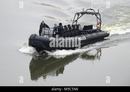 London, UK, 24 Mar 2018. A police RIB (Rigid Inflatable Boat) on patrol on the Thames shortly before the start of the Oxford and Cambridge Boat Races. Credit: Michael Preston/Alamy Live News Stock Photo