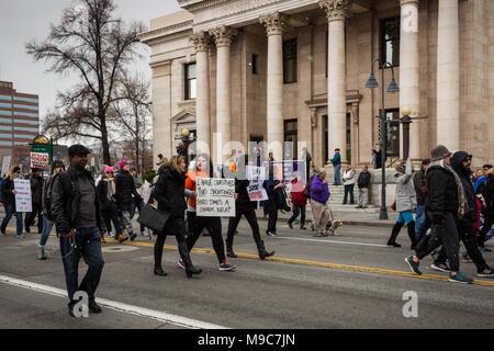 Reno, Nevada, USA. 24th Mar, 2018. Participants move along S. Virginia Street in front of the Washoe County Courthouse during the March for Our Lives event in Reno, Nevada, on Saturday, March 24, 2018. Credit: Tracy Barbutes/ZUMA Wire/Alamy Live News Stock Photo