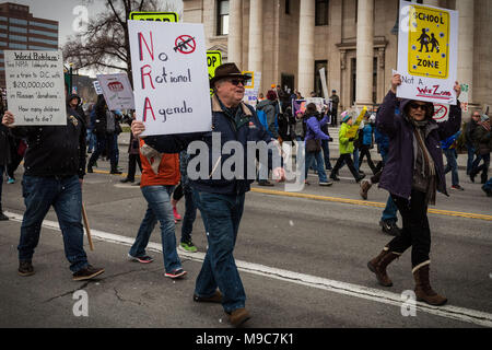 Reno, Nevada, USA. 24th Mar, 2018. Participants move along S. Virginia Street in front of the Washoe County Courthouse during the March for Our Lives event in Reno, Nevada, on Saturday, March 24, 2018. Credit: Tracy Barbutes/ZUMA Wire/Alamy Live News Stock Photo