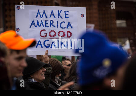 Reno, Nevada, USA. 24th Mar, 2018. A participant in the March for Our Lives event in Reno, Nevada, on Saturday, March 24, 2018, holds a sign saying, ''Make America Good Again.''.The event is one of hundreds of similar such events at cities around the country that have sprouted off a national march in Washington, DC, organized by student survivors of the February 14 shooting at Marjory Stoneman Douglas High School in Florida where 17 were killed. Credit: Tracy Barbutes/ZUMA Wire/Alamy Live News Stock Photo