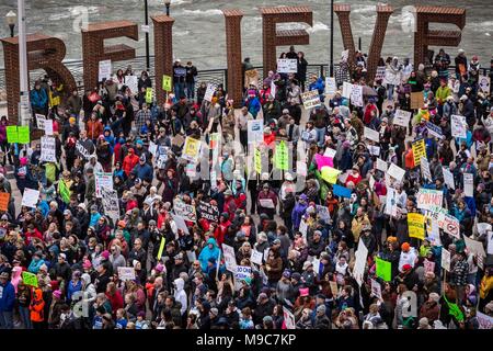 Reno, Nevada, USA. 24th Mar, 2018. Hundreds of participants of the March for Our Lives event gathered at the Reno City Plaza, sometimes referred to as the Believe Plaza, along the Truckee River in Reno, Nevada, on Saturday, March 24, 2018.The event is one of hundreds of similar events at cities around the country that have sprouted off a national march in Washington, DC, organized by student survivors of the February 14 shooting at Marjory Stoneman Douglas High School in Florida where 17 were killed. Reno artists Jeff Schomberg and Laura Klimpton created the BELIEVE sculpture, which de Stock Photo