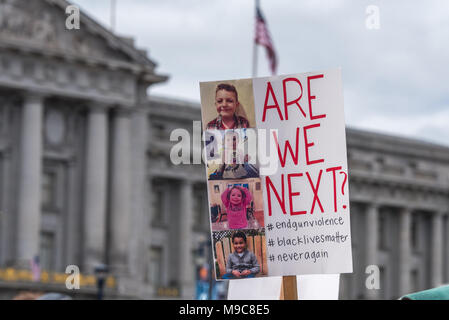 San Francisco, USA. 24th March, 2018. March for Our Lives rally and march to call for gun control and end gun violence; at the rally in front of San Francisco City Hall a homemade sign reads 'Are we next?' with pictures of four children. Shelly Rivoli/Alamy Live News Stock Photo