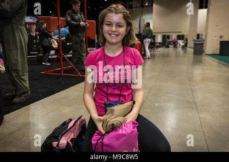 Reno, Nevada, USA. 24th Mar, 2018. MAIA SHEARD packs swag into her swag bag during the ''Girls in Aviation Day'' at the the 29th Annual Women in Aviation International (WAI) Conference at the Reno-Sparks Convention Center in Reno, Nevada, on Saturday, March 24, 2018. The eighth grader isn't sure what she wants to do when she gets older, but says is enjoying her first visit to the conference. She is attending with her aunt who is a helicopter pilot in Southern California. Credit: Tracy Barbutes/ZUMA Wire/Alamy Live News Stock Photo