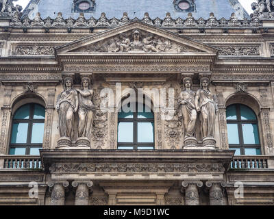 Detail of the facade of one of the buildings surrounding the inner courtyard of the Louvre Museum, Paris, France.