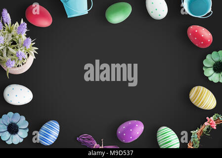 Easter background with colorful eggs on black background. Stock Photo