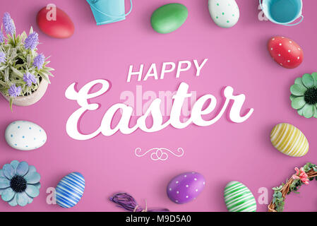Glat lay happy easter composition with greeting text on pink background. Stock Photo