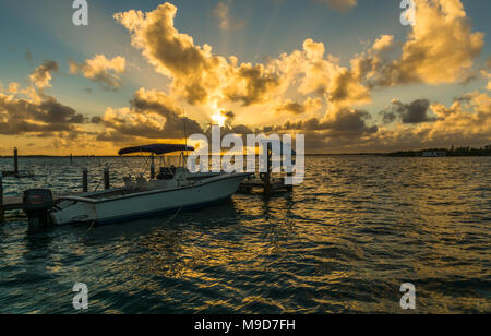 Early morning Bahamian sunrise featuring gorgeous colorful high contrast sky with colorful clouds Stock Photo