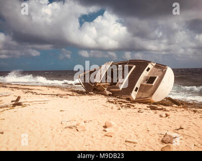 Old ship wreck, stranded boat on beach - vintage style Stock Photo