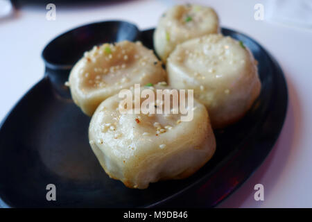 Shanghai pan fried pork dumpling on white plate Stock Photo