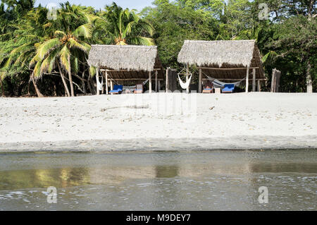 Palm-frienged private beach of Morgan's Rock Hacienda and Ecolodge in Nicaragua, Central America Stock Photo