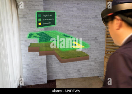 iot smart industry 4.0 agriculture concept,agronomist,farmer(blurred) using smart glasses (augmented mixed virtual reality,artificial intelligence tec Stock Photo