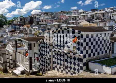 Cemetery on the island of Guadeloupe with many elaborately tiled tombs in black and white Stock Photo