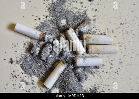 after cigarette A lot of cigarette piece with ash after smoking shattered on the floor  Stock Photo