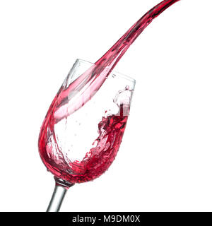 red wine pouring into glass isolated on white background, studio photo Stock Photo