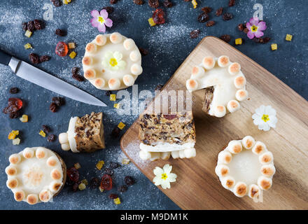 Homemade miniature simnel cakes on slate. Stock Photo