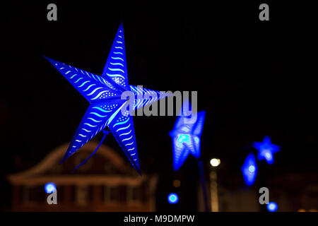 Blue star lights hanging in a park at Waterfire in Providence, Rhode Island. Stock Photo
