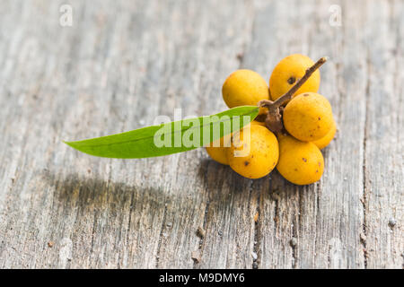 Rauwenhoffia siamensis Scheff fruit  on wood Stock Photo