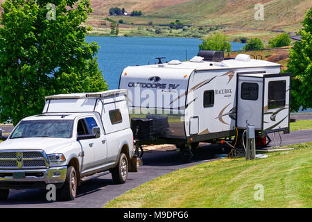 42,903.04270 RAM 2015 pickup truck, 2017 Outdoor RV’s Black Rock camping trailer, Heppner, Oregon RV campground by lake reservoir Stock Photo