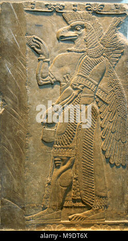 Relief with protective spirit (Eagle-headed). From Assyrian Temple of Ninurta, Nimrud, about 865-860 BC. Stock Photo