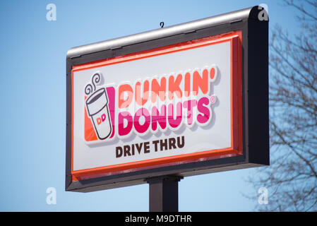 A Dunkin' Donuts pole sign at a restaurant in Gloversville, NY USA Stock Photo