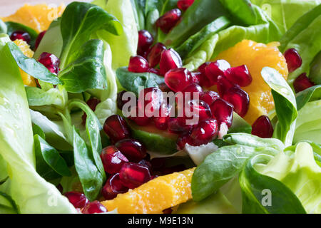 Detail of pomegranate seeds in a fruit and vegetable salad Stock Photo
