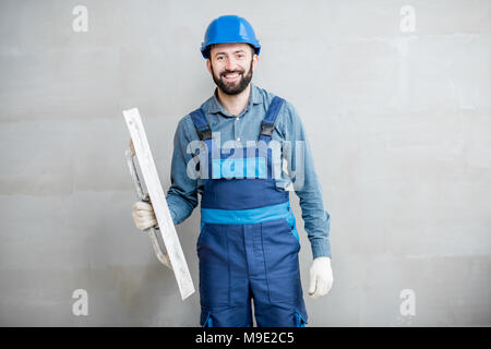 Plasterer working indoors Stock Photo